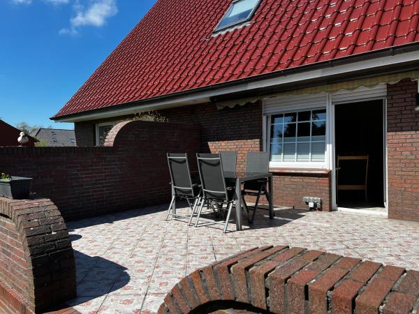 写真にはBerumbur市にあるGroße Ferienwohnung In Berumbur Mit Grill, Terrasse Und Garten, In Der Nähe Eines Kiesseesが写っています。