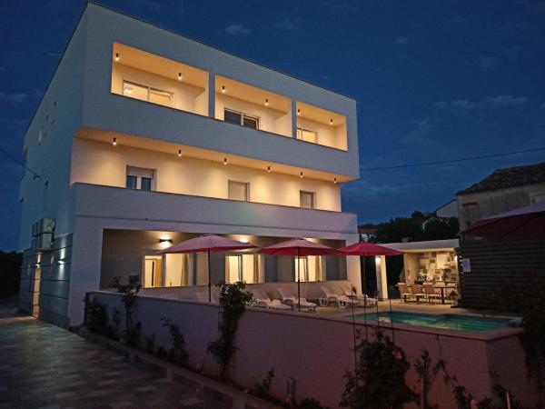 A la foto es mostra l'objecte Apartmant & rooms Villa Rosa Medulin situat a la ciutat de Pomer.