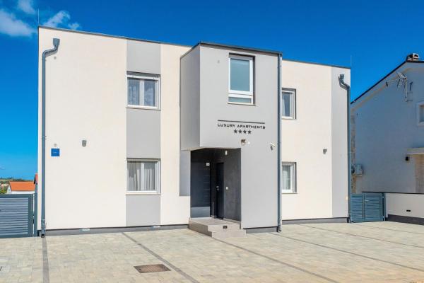 A la foto es mostra l'objecte Apartments with parking space Vir - Lozice, Vir - 22215 situat a la ciutat de Vir.
