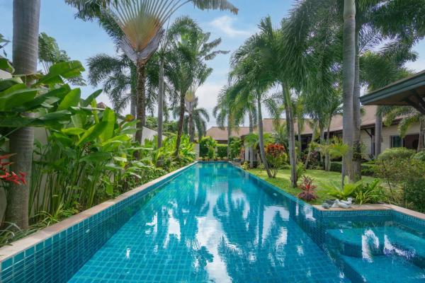 The photo shows the VILLA LETI Luxury Private villa with 22 meters private pool Kokyang Estate 3 min to Naiharn Beach located in the city of Rawai Beach.