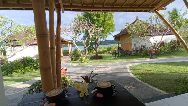 A la foto es mostra l'objecte Pasir Putih Cottage - Menjangan situat a la ciutat de Pulau Menjangan.