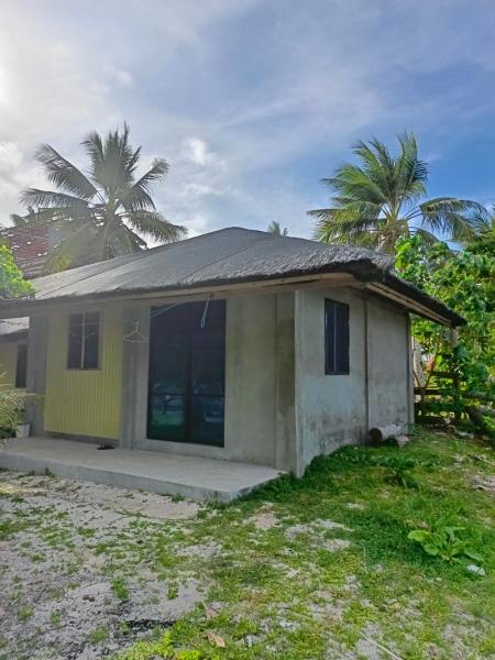 The photo shows the Coastline Homestay located in the city of Buhing Calipay.