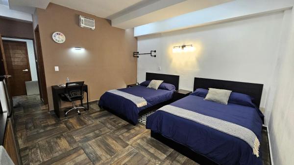 照片显示了位于Cuautitlán市的A22 Premium Suite BLACK MAX Cocina Terraza Companies Work Teams 2-4 PAX物件。