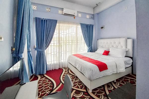 Na fotografii je vidět objekt RedDoorz Syariah at Masrun Homestay Bangkinang nacházející se ve městě Bangkinang.