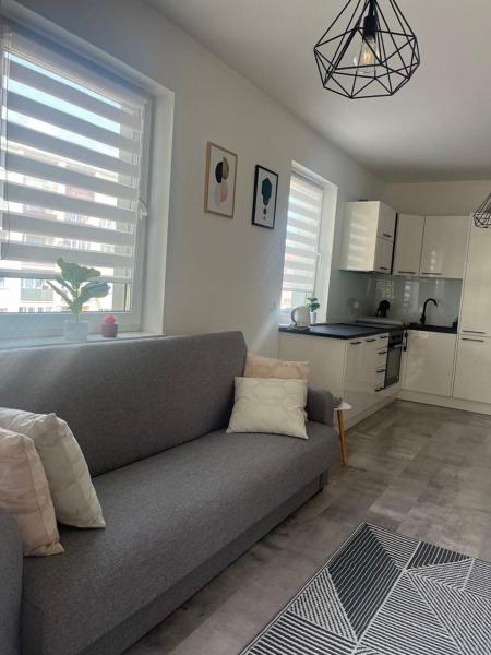 The photo shows the Apartament LUCA z balkonem located in the city of Dobroszyce.