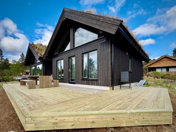 Na foto é possível ver o objeto Brand new cabin at Hovden cross-country skiing localizado na cidade de Bykle.