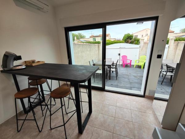 Nella foto è visibile l'oggetto Maison classé 3 étoiles Pérols avec terrasse et clim situato nella città di Pérols.