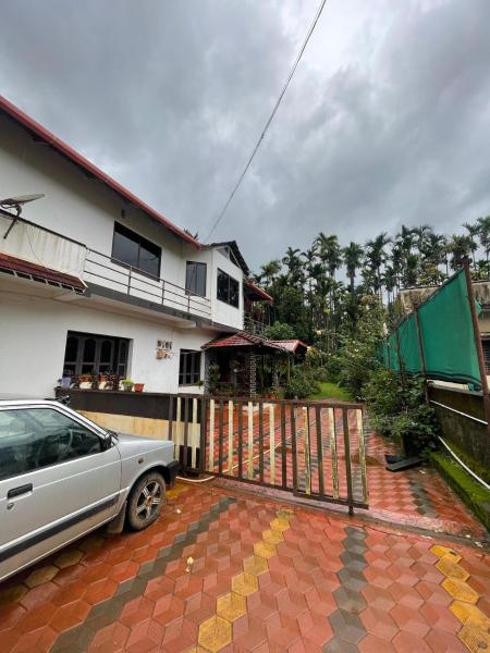 Auf dem Foto ist das Objekt Nisarga Homestay in der Stadt Navūru zu sehen.