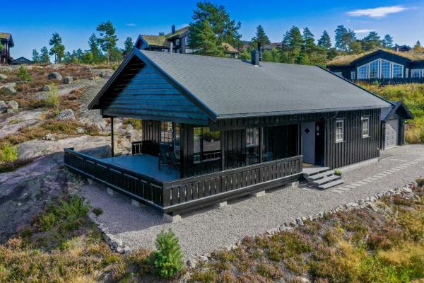 På billedet ses objektet Family Cabin With Views Of Nisser And Vrådal beliggende i byen Heimdal.