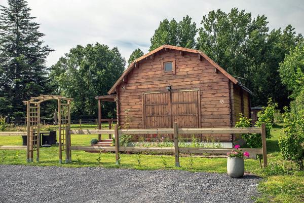 Na zdjęciu widoczny jest obiekt Wooden Lodge położony w mieście Saint-Blimont.
