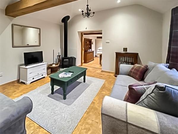 A la foto es mostra l'objecte Byre Cottage situat a la ciutat de Five Oaks.