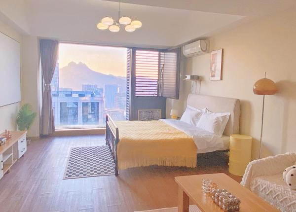 La photo montre l'objet Azure Haven Seaview Suites Shilaoren Coast situé dans la ville de Qingdao.