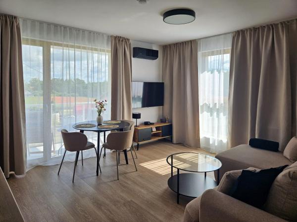 Na fotografii je vidět objekt Kairos Apartments -Atos - darmowy parking, klimatyzacja nacházející se ve městě Drwęck.
