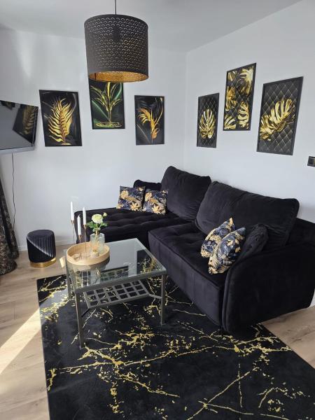 The photo shows the Apartament Augustów Nikola located in the city of Augustów.