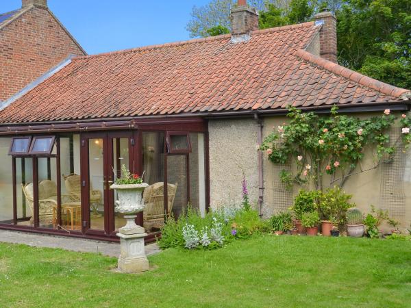 A la foto es mostra l'objecte Forge Cottage situat a la ciutat de Happisburgh.