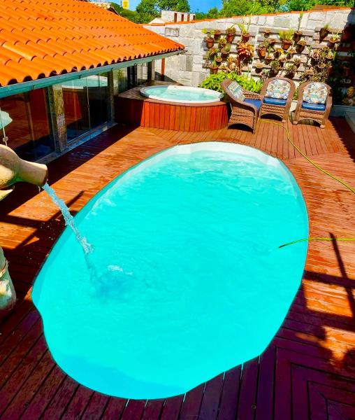 A la foto es mostra l'objecte Casa charmosa com piscina aquecida, jacuzzi, ar situat a la ciutat de Pirenópolis.