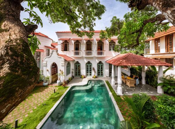 The photo shows the Villa Giulietta by The Blue Kite, Premium 4BHK Indo-Portuguese Villa with Pvt Pool, Bathtub, Gazebo, Caretaker & Security located in the city of Assagao.