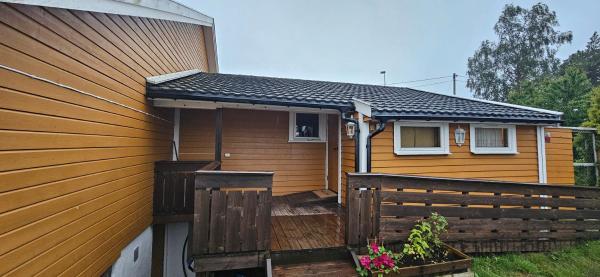 The photo shows the Cabin on Åros, close to the beach located in the city of Søgne.