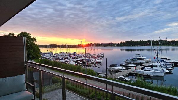 Auf dem Foto ist das Objekt Sunset View - MAZURIA APARTAMENTY in der Stadt Ostróda zu sehen.