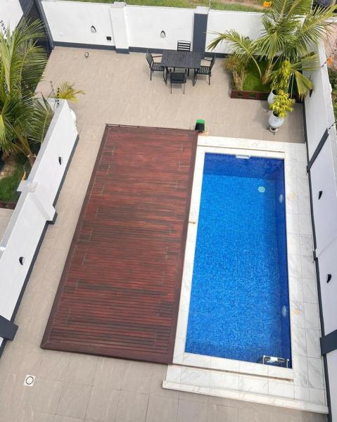 A la foto es mostra l'objecte The Minimalist House With A Private Swimming Pool situat a la ciutat de Accra.