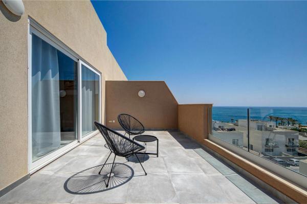 The photo shows the Seaview 3BR Penthouse Escape with Terrace Views by 360 Estates located in the city of Il-Kappara.