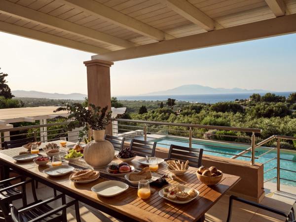 Na foto é possível ver o objeto Villa Merovigli - Sea Views & Private Pool, Ideal for Large Groups, by ZanteWize localizado na cidade de Tragaki.