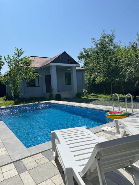 The photo shows the Private Pool located in the city of Nohurqışlaq.