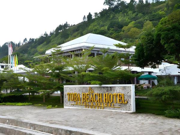 The photo shows the Toba Beach Hotel located in the city of Tomok.