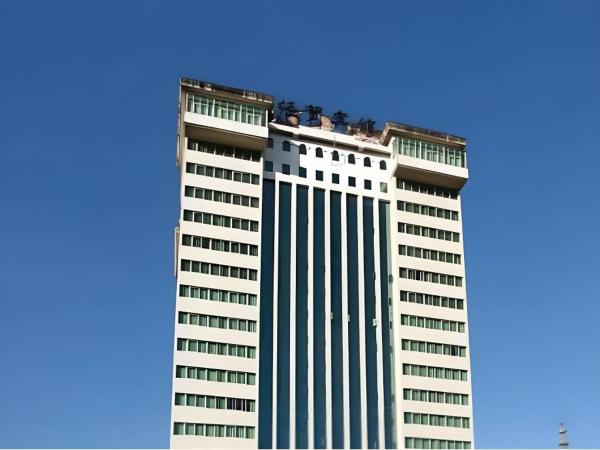 På billedet ses objektet Economic Trade Hotel beliggende i byen Kunming.