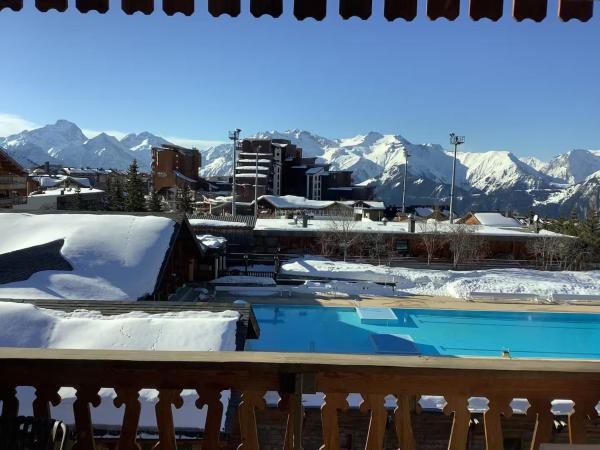 A la foto es mostra l'objecte Alpe d'Huez Houses - 2 chambres à la Menandiere vue magnifique situat a la ciutat de Huez.