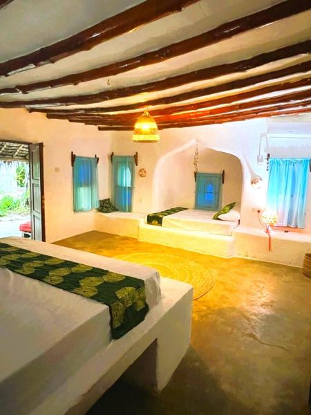The photo shows the Kimulimuli Ayurveda Spa Retreat located in the city of Kiganga.