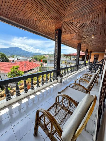 The photo shows the Monton Guest House located in the city of Tobonga.