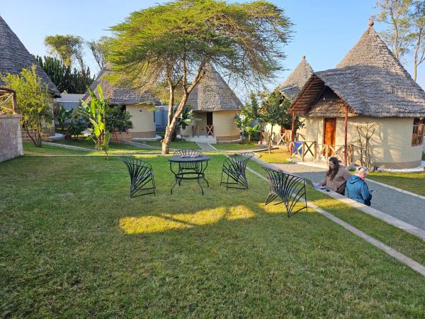 The photo shows the Oiti Boma Lodge Arusha located in the city of Mkulat.