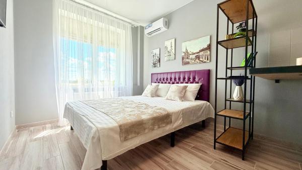 A la foto es mostra l'objecte Violet smart apartment situat a la ciutat de Khàrkiv.