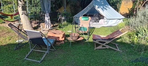 Auf dem Foto ist das Objekt Camp, tent jurta for 4 guests, Ljubljana, shared bathroom and outdoor kitchen in der Stadt Mrše zu sehen.