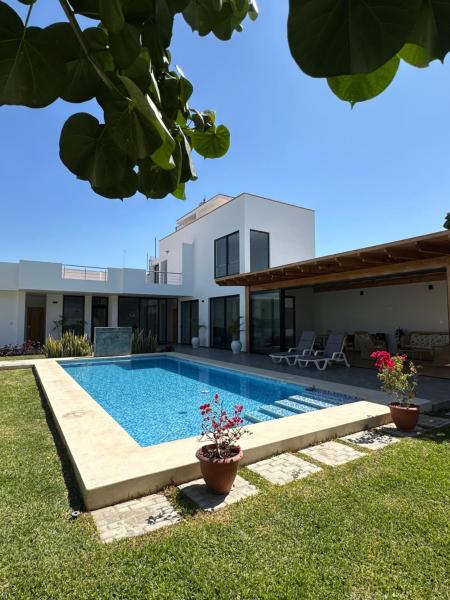 Na foto é possível ver o objeto Casita en Ica con piscina localizado na cidade de Sunampe.