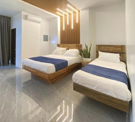 The photo shows the AC Cosy Hotel located in the city of Lala.