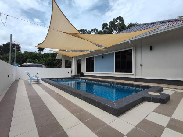 На фото показан объект Mar'wanis Villa Homestay Beaufort Sabah, расположенный в городе Bambangan.