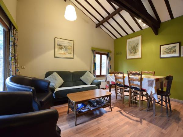 The photo shows the Forest Cottage with Ponds located in the city of Les Hayons.