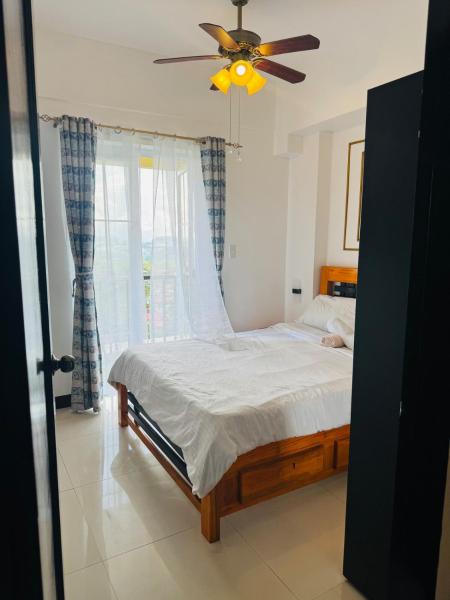 Фотография 3: 2BR with Veranda, Unli Netflix, Wifi