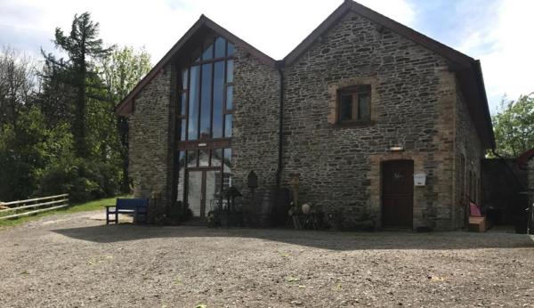 A la foto es mostra l'objecte Tondu House Farm situat a la ciutat de Aberkenfig.