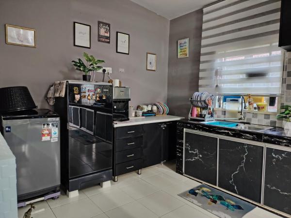 Na zdjęciu widoczny jest obiekt CozyRustic Homestay Melaka położony w mieście Kampong Bukit Katil.
