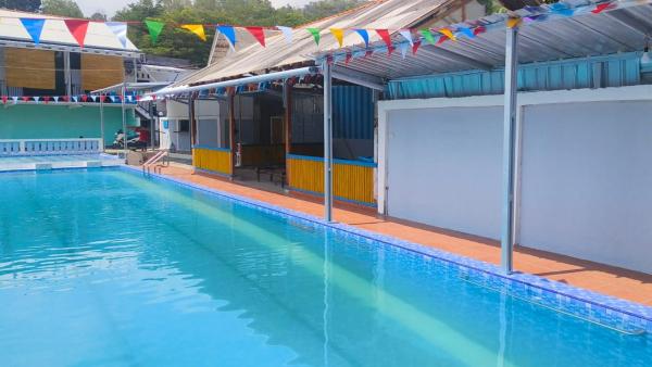 Op de foto is het object Surya Abadi Homestay Syariah RedPartner te zien, gelegen in de stad Ayah.