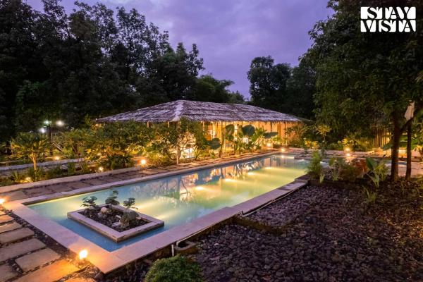 The photo shows the StayVista at The Wildernest Tale with Bonfire, Jacuzzi located in the city of Bhandardara .