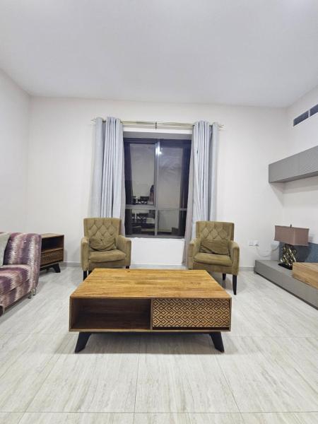Na fotografii je vidět objekt Charm 1BR Bright Living Space nacházející se ve městě Adžmán.