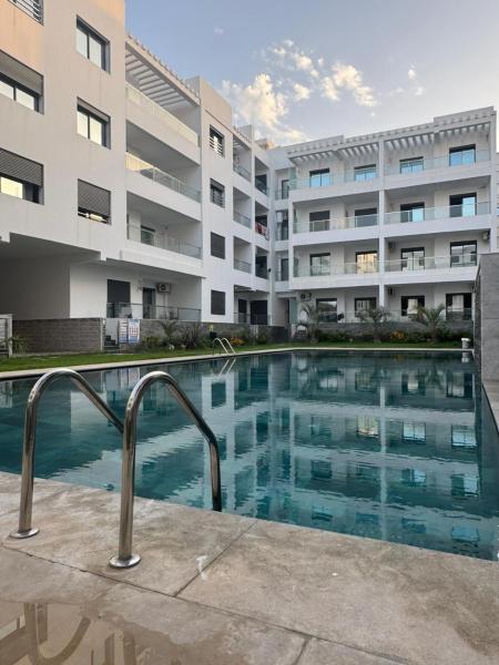 På billedet ses objektet Aroussat Annakhil-213-Pool-2km beach-Airport beliggende i byen Martil.