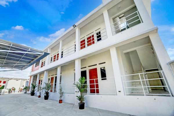 写真にはDau市にあるOYO Madani Guest House Syariahが写っています。
