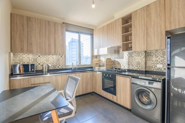 Фотография 4: Elevate - Sleek 2-BR Apt by Santa Maria, Jal el Dib