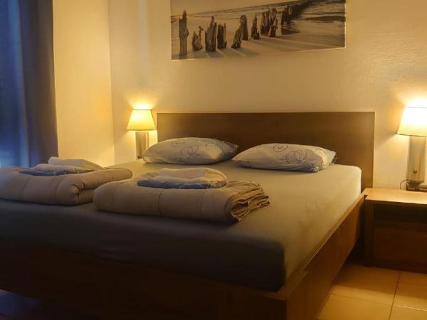 The photo shows the Villa Peragi - Triple Room with Balcony located in the city of Molunat.