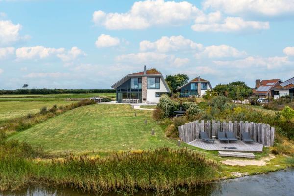 На фото показан объект Natuurvilla 16 Weegeswaal, расположенный в городе Де-Вал.